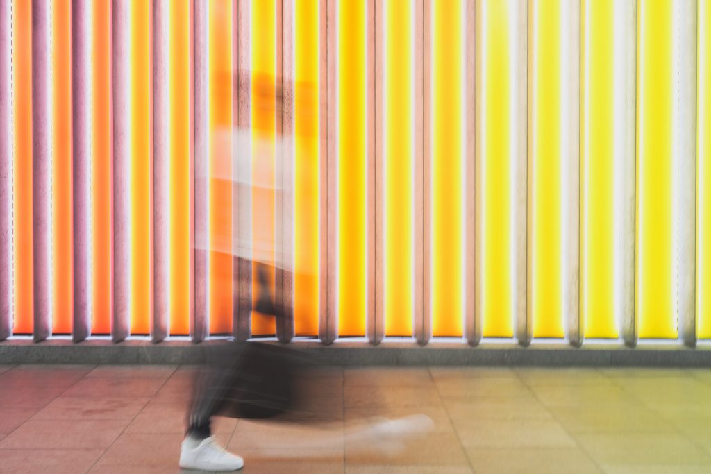 Blurred image of man walking